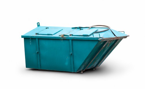 Waste collection vehicle departing a commercial site with secured load